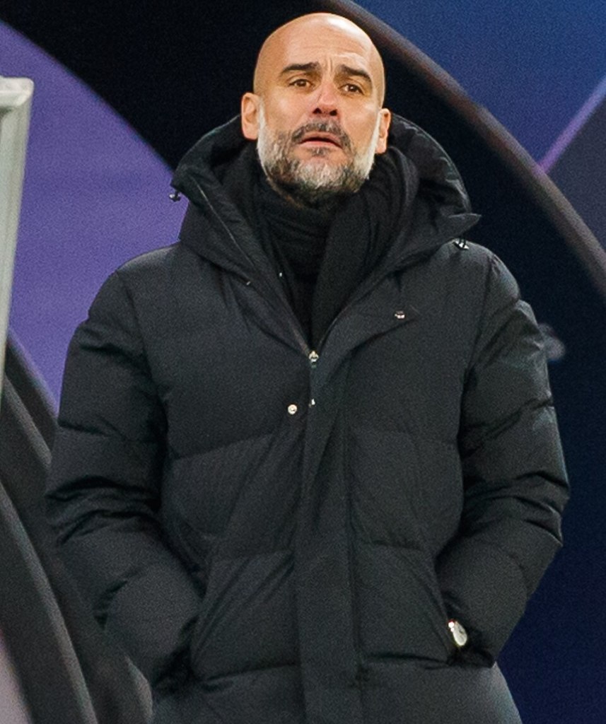Pep Guardiola managing Manchester City during a Champions League match in 2021