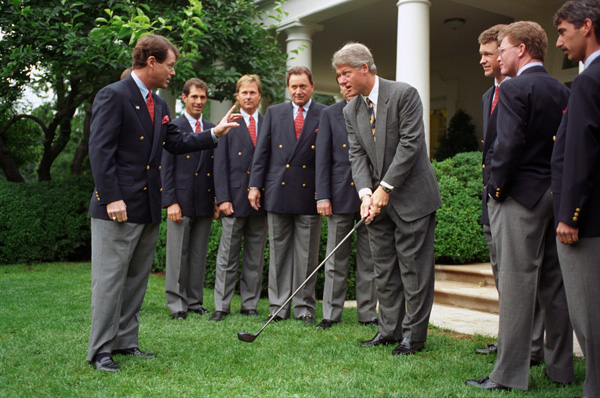 President Bill Clinton receiving golf tips from members of the 1993 United States Ryder Cup team at the White House